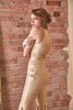 RoubaG's gold-ivory flared pants jumpsuit with honeycomb cuts and open back