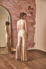 RoubaG's gold-ivory flared pants jumpsuit with honeycomb cuts and open back